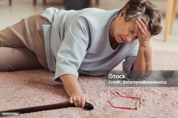 Sick Senior Woman With Headache Stock Photo - Download Image Now - Falling, Senior Adult, Senior Women