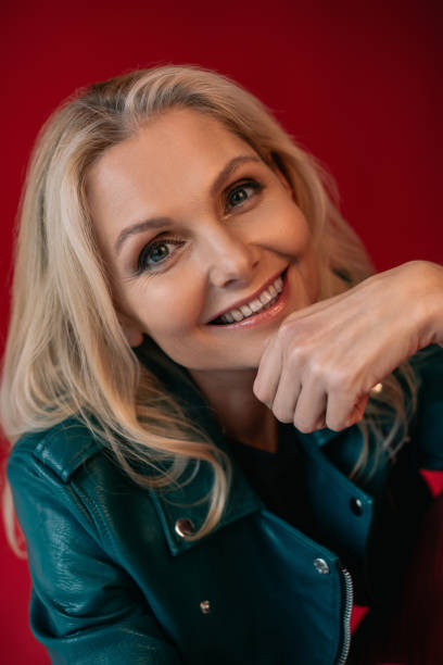 istock woman in leather jacket 909002030