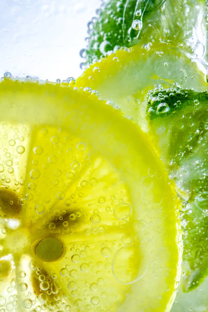 istock Lemon drop in fizzy sparkling water, juice refreshment 909005368