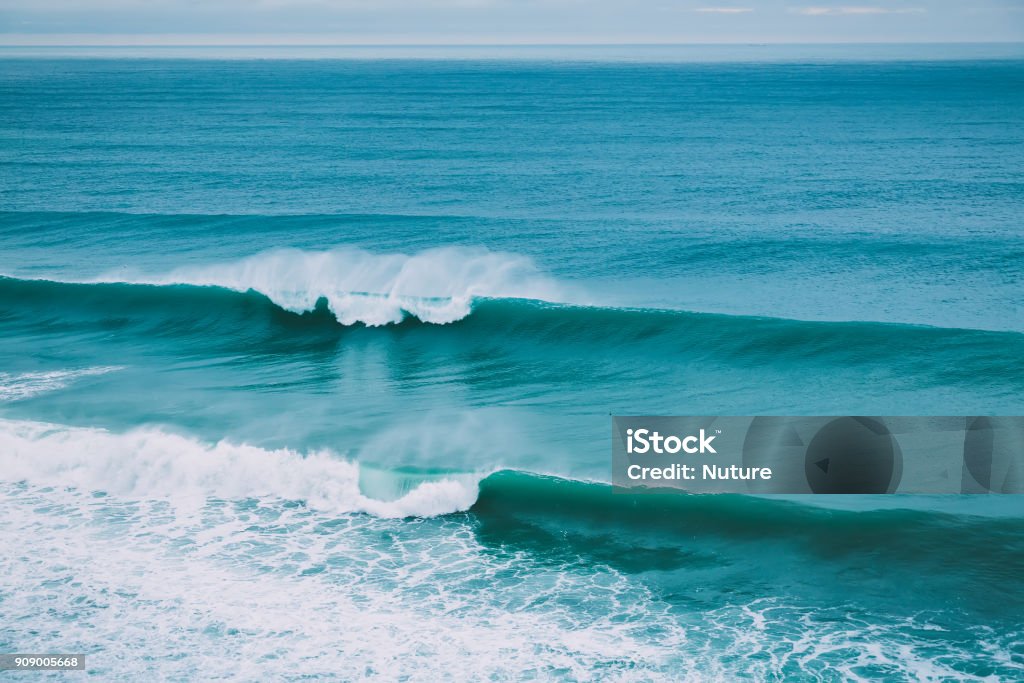 Crashing big wave in ocean and cloudy weather. Swell for surfing Crashing big wave in ocean and cloudy weather. Barrel waves for surfing Wave - Water Stock Photo