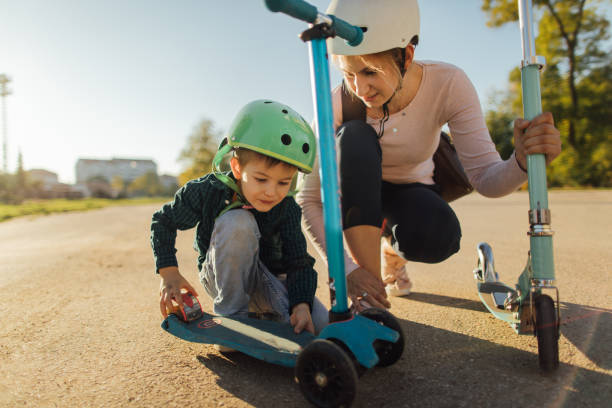 istock Repairing my push scooter together 909006506