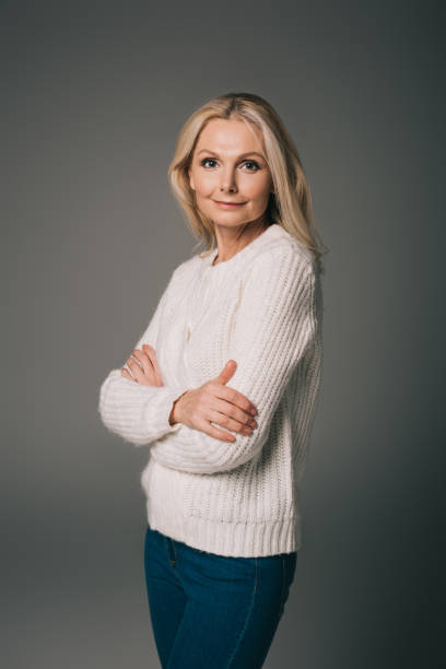 istock mature woman with crossed arms 909006844