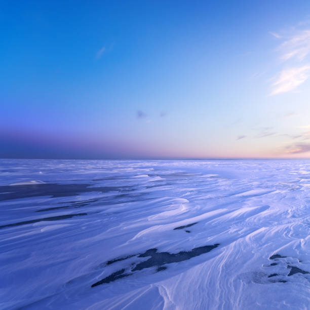 istock ice desert sunrise on the lake 909009378