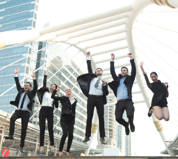 istock Happy business teamwork group jump up. concept celebration success for work. 909019986