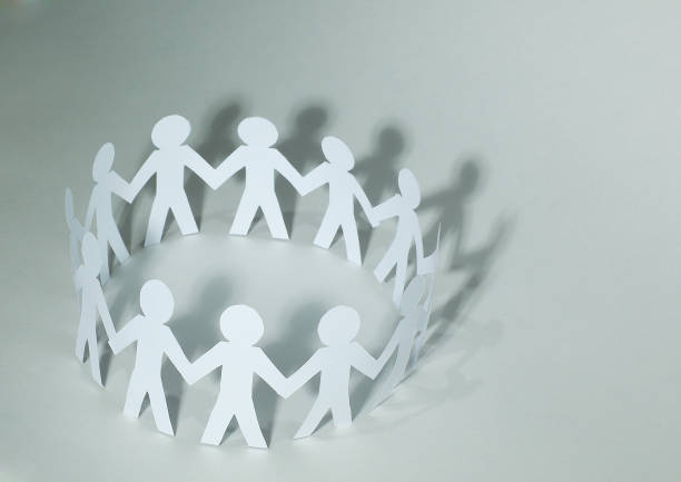 istock business background.team paper men standing holding hands 909020534