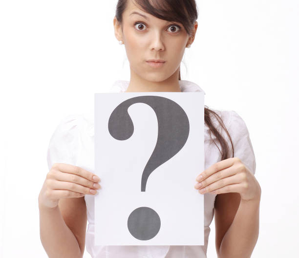 istock surprised business woman showing a question mark 909020772