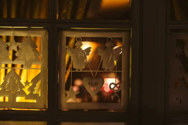 Paper decorations on the windows of a Christmas house in Strasbourg, Alsace France during Christmas Market