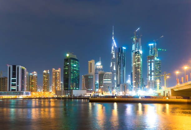 istock modern buildings near water in modern city 909026450