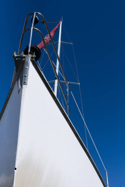 istock Steel white ship bow closeup over blue sky 909028940