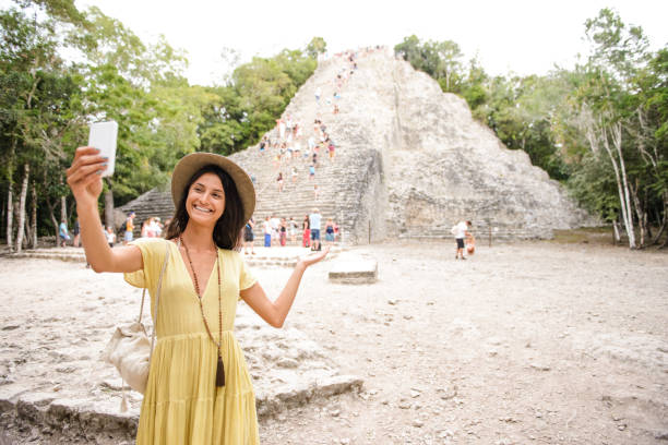 istock Smiling tourist making self portrait. 909029034