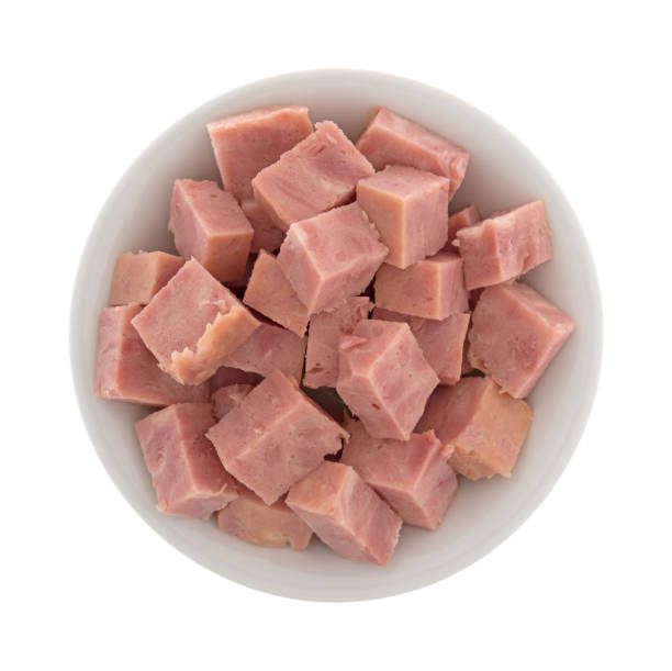 istock Chunks of cut up canned ham in a white bowl 909036544