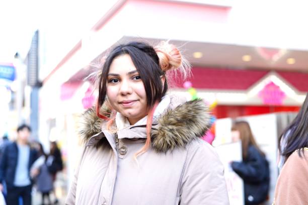 istock Young woman standing outside 909037312