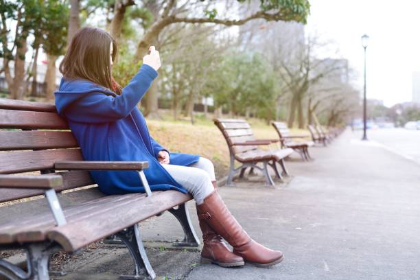 istock Teenager sitting outside 909041008