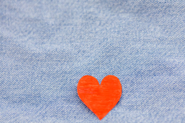istock Paper red heart with Denim jeans texture background. Valentine Concept 909042472