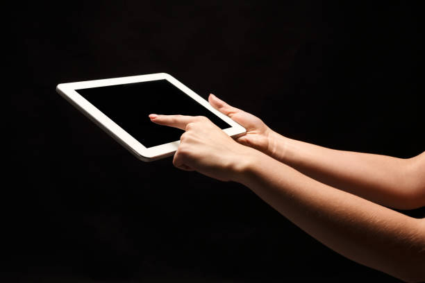 Close-Up Of Digital Tablet Against White Background