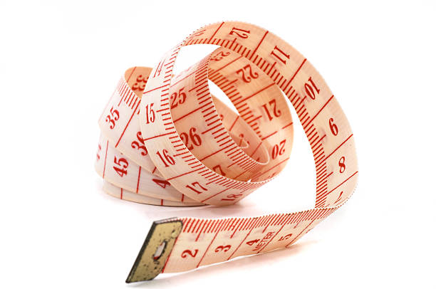 istock Rolling out measuring tape, unraveling 90904390