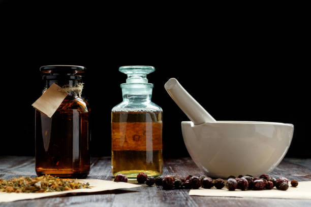 istock apothecary vintage bottles and mortar 909044608