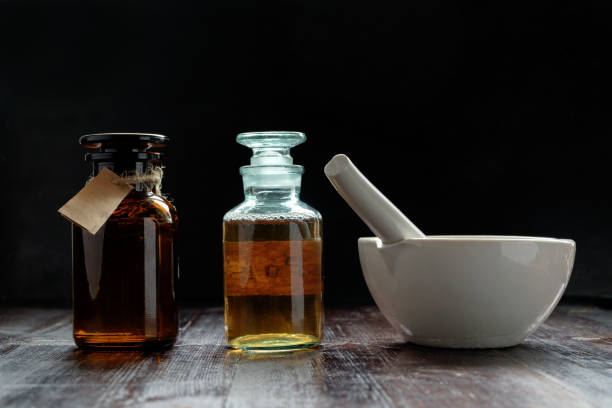 istock apothecary vintage bottles and mortar 909044614