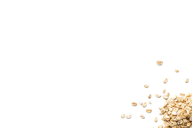 istock Organic oat flakes isolated on white background 909045218
