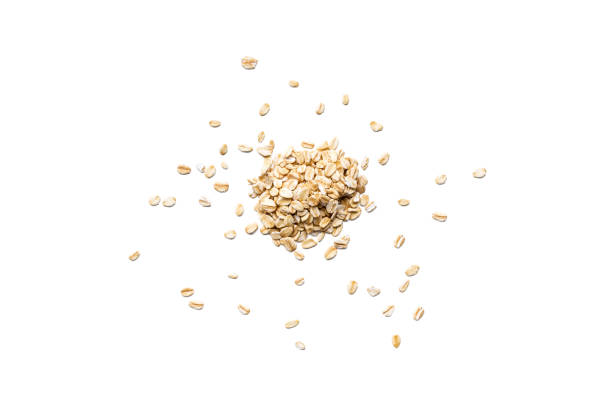 Organic oat flakes isolated on white background