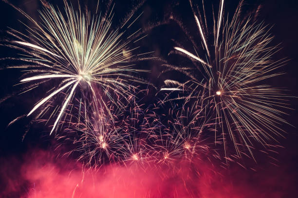 istock Spectacular fireworks show light up the sky. New year celebration. 909045920