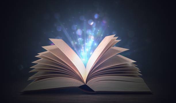 Open shining magic book on dark background. 3D rendered illustration. Open shining magic book on dark background. 3D rendered illustration. religious text stock pictures, royalty-free photos & images