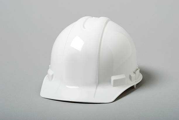 white bauarbeiterhelm - helmet stock-fotos und bilder