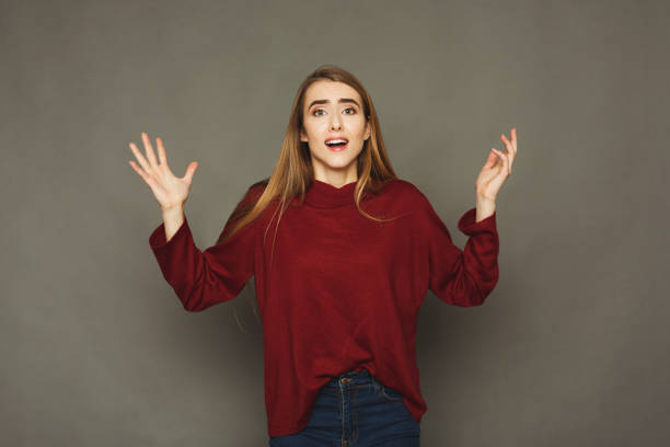 istock Surprised young woman studio portrait 909049638