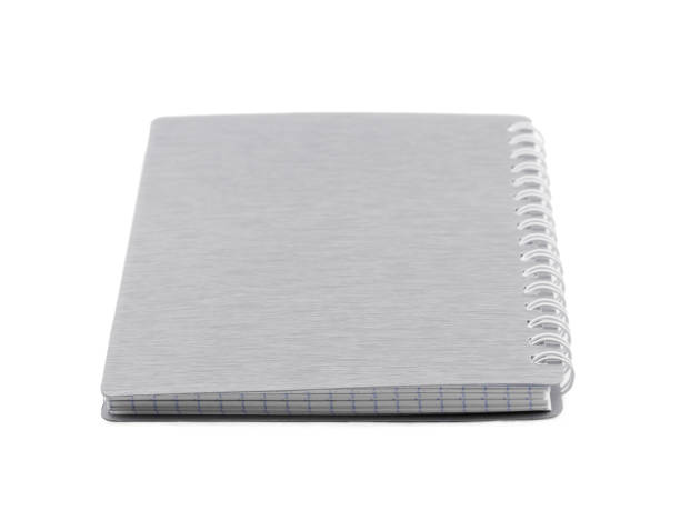 istock One notepad with spiral mount gray color. Isolated on white. Foreground. 909050120