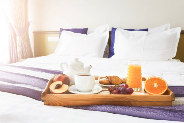 istock Breakfast served in bed on wooden tray 909050632