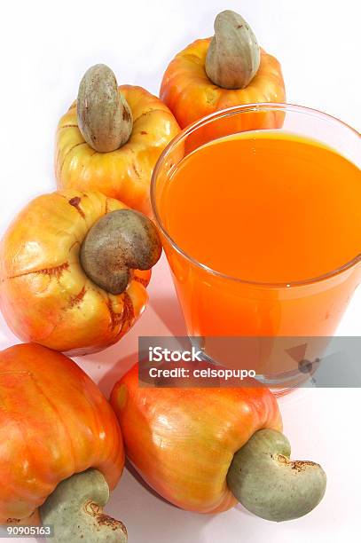 Foto de Castanhadecaju e mais fotos de stock de Castanha-de-Caju - Castanha-de-Caju, Laranja - Descrição de Cor, Suco