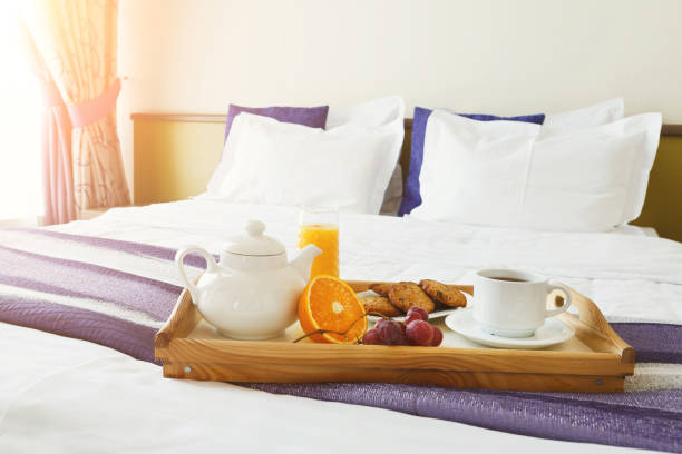 istock Breakfast served in bed on wooden tray 909052726
