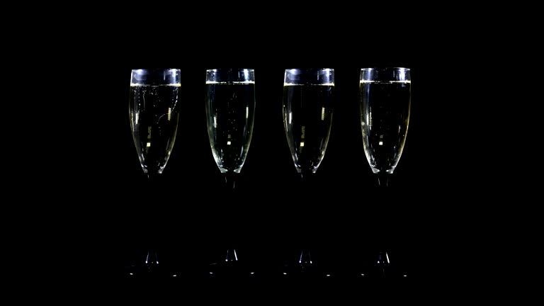 Foer of-champagne glasses vith alpha Chunnel