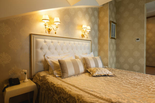 istock Interior of double bed hotel bedroom 909053408