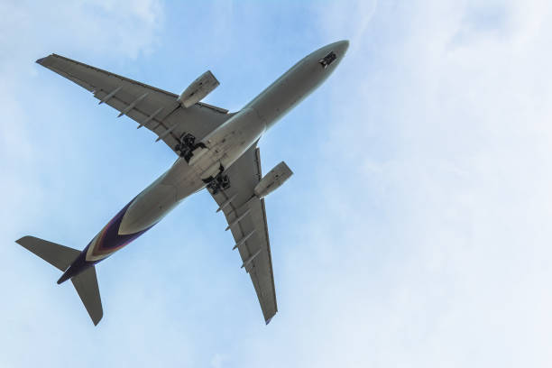 istock Under view of Airplane in the cloudy sky for background 909054544