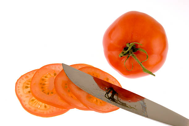 Tomato and knife stock photo