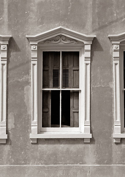 istock beautiful old window in a small Southern town sepia toned 90906540