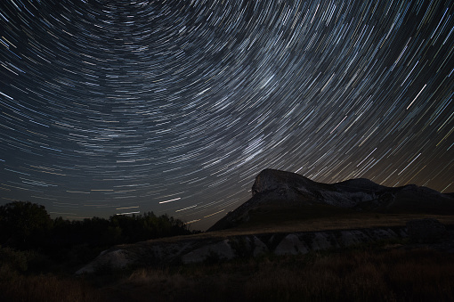 Polar Star at the center of rotation. Lateral light from the full moon on the chalk hills.