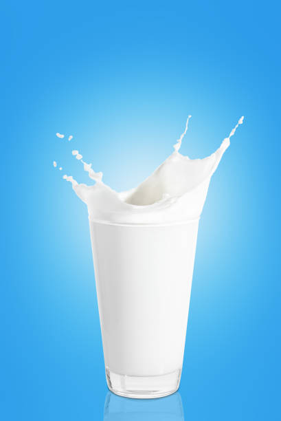 istock glass of milk with splashes 909070642