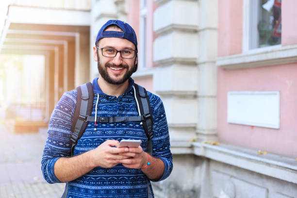 istock Portrait of smiling young man 909073824