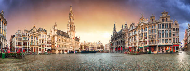 Brussels - panorama of Grand place at sunrise, Belgium Brussels - panorama of Grand place at sunrise, Belgium belgian culture photos stock pictures, royalty-free photos & images