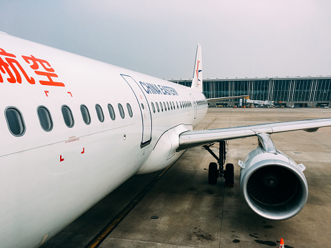 Shanghai, China - 12 4 2017: China Eastern airplane is loading at International airport Pudong Shanghai, China. Pudong international airport is a major aviation hub of China.