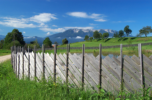                                 Wooden fence and view to Alps in Slovenia