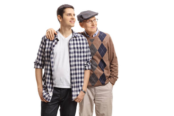 istock Young guy and an elderly man looking away 909084506