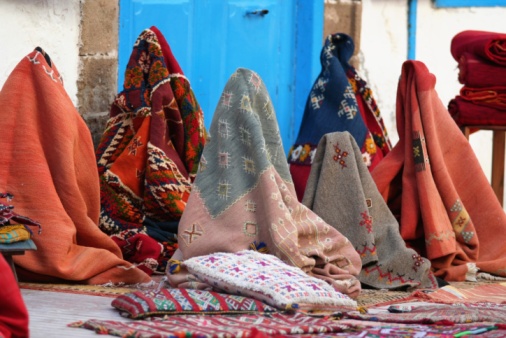 A lady looks at the merchandise in a market in Khiva, Uzbekistan