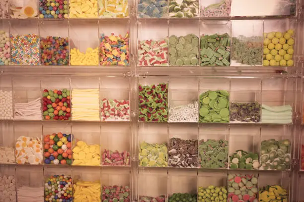 Photo of candys and sweets different colors in supermarket