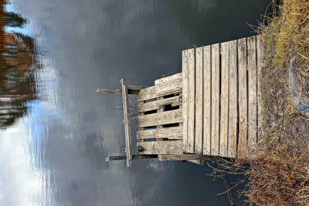 istock Wooden bridge over the water 909089108