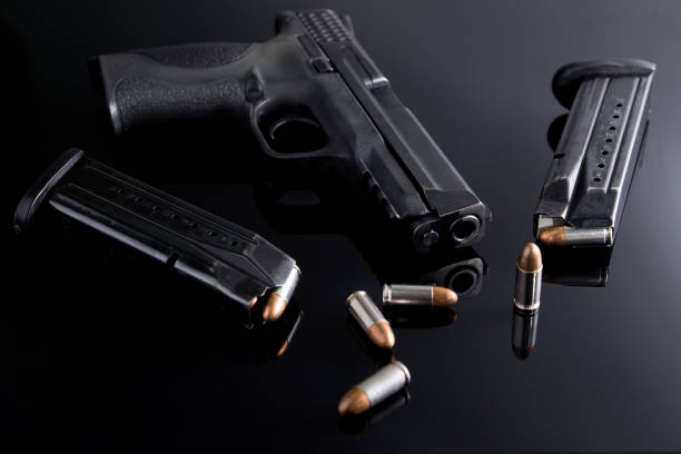 istock 9mm Pistol gun with ammunition 909092660