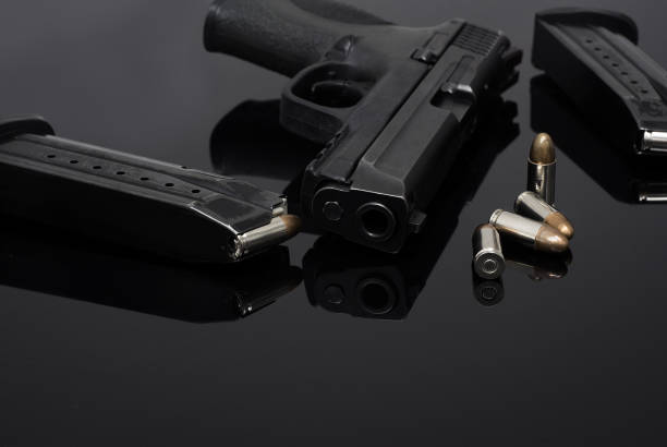 istock 9mm Pistol gun with ammunition 909092662