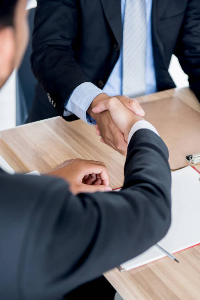 istock handshake for business and teamwork for achievement KPI and goal 909093604